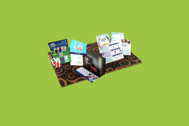 A collection of business cards and brochures as inspiration for the 2023 Direct Mail Campaign.