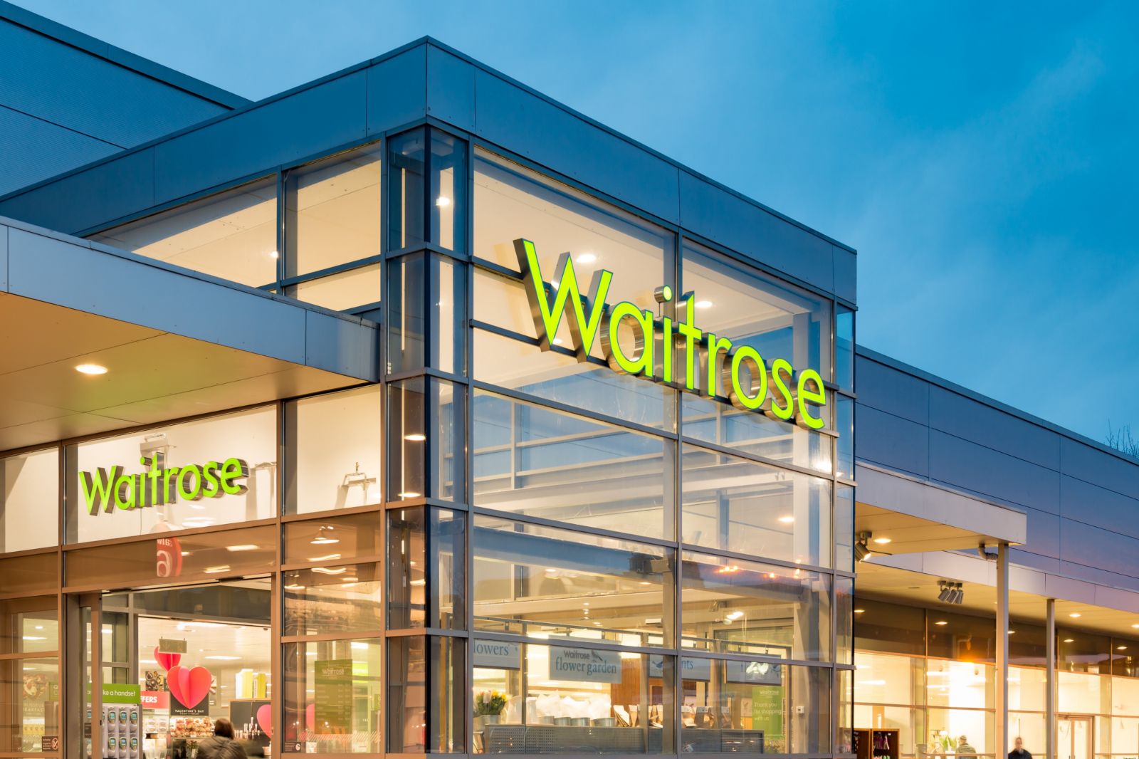 A store with a sign that says Wilfred's Waitrose and Partners.