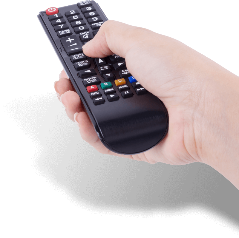 Hand using TV remote